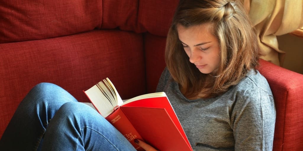 A young girl reading.